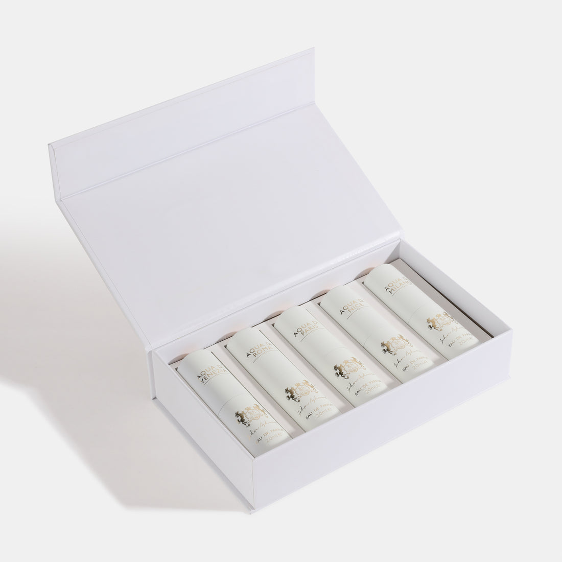 5 PC GIFT SET WHITE EDP Open white box containing rolled-up items on a light gray background. House Of Perfumes India