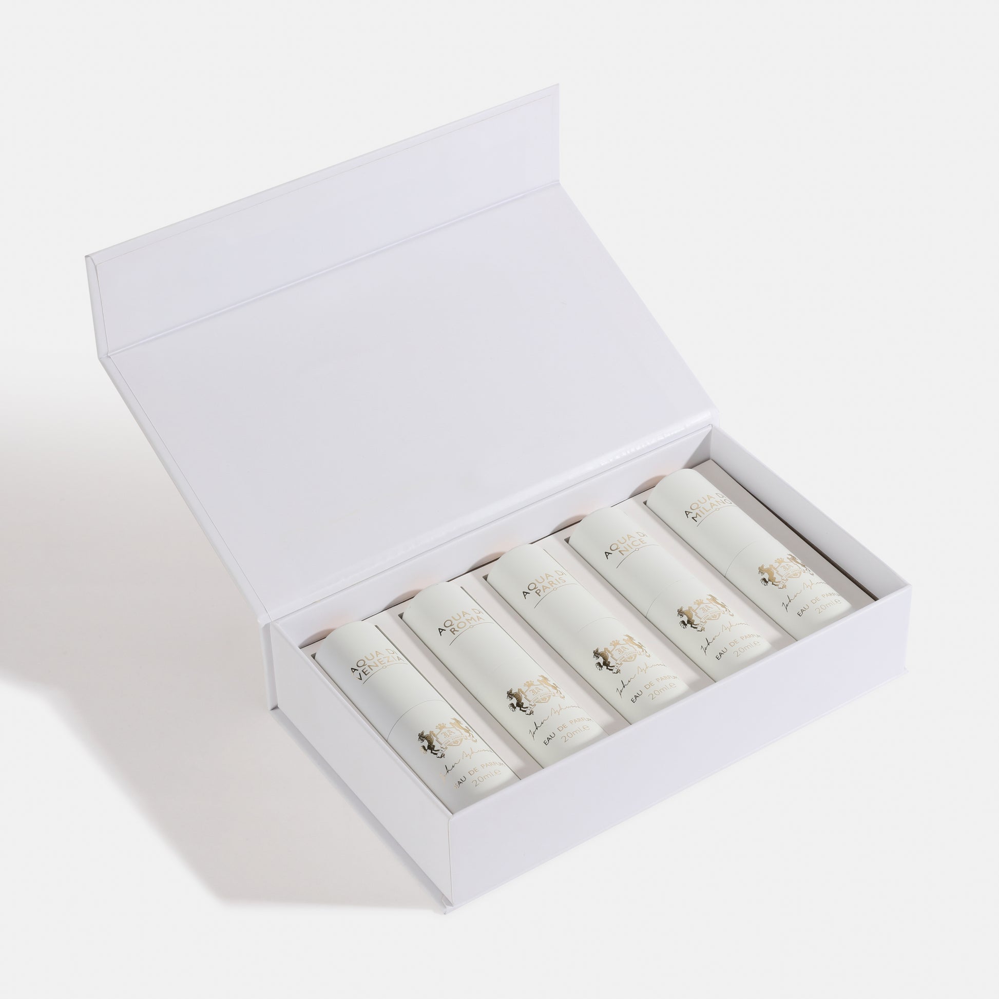 5 PC GIFT SET WHITE EDP Open white box containing rolled-up items on a light gray background. House Of Perfumes India
