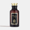 A dark amber glass perfume bottle with a gold-colored cap, labeled 'Black Oud Eau de Parfum 100ml'.