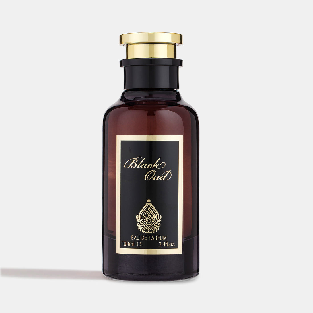 A dark amber glass perfume bottle with a gold-colored cap, labeled 'Black Oud Eau de Parfum 100ml'.