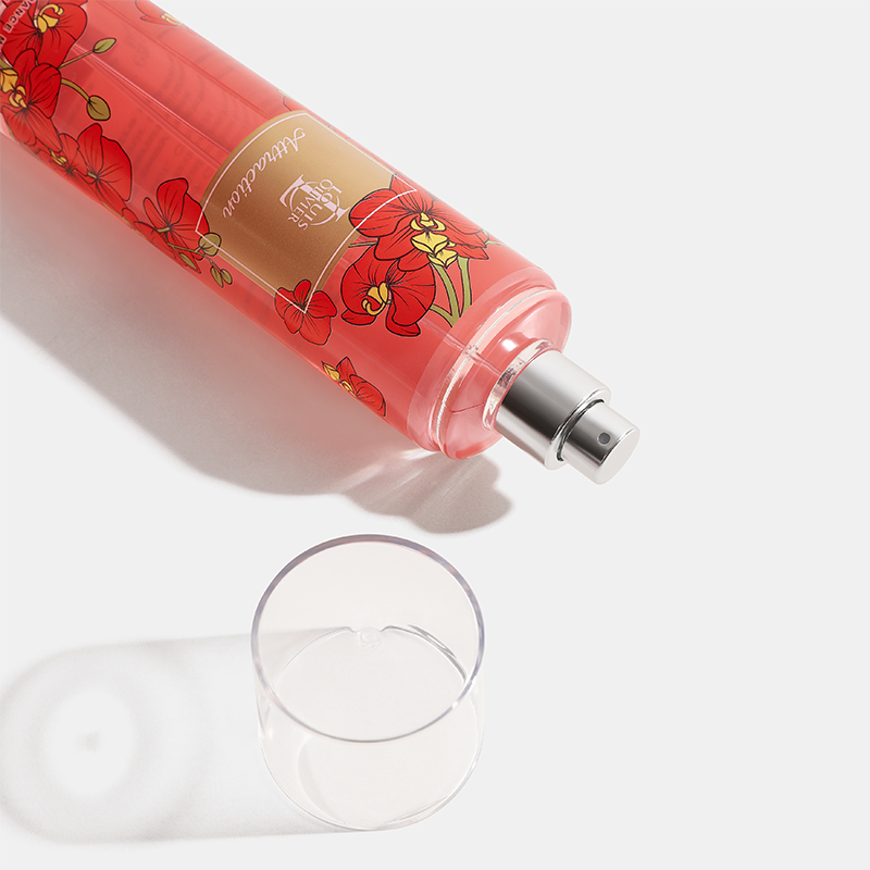 Decorative bottle with floral design and a glass on a light background  Bouquet-Gift-Set House of Perfumes India