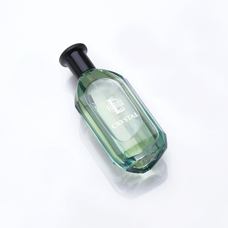 Crystal Green perfume bottle with black cap on a white background. House Of Perfumes India