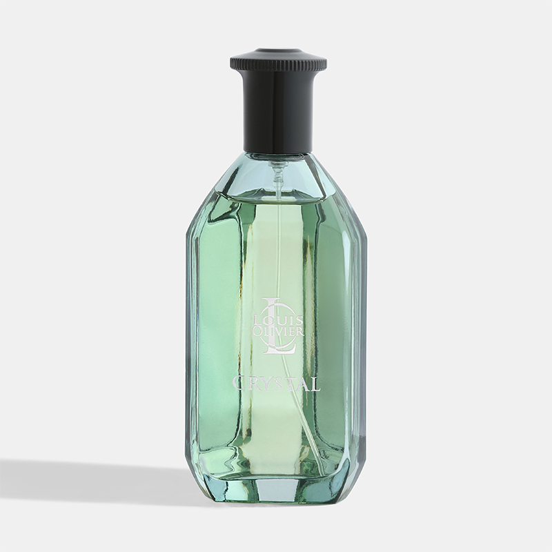 Green glass bottle with black cap on a light gray background Crystal-Gift-Set House of perfumes India