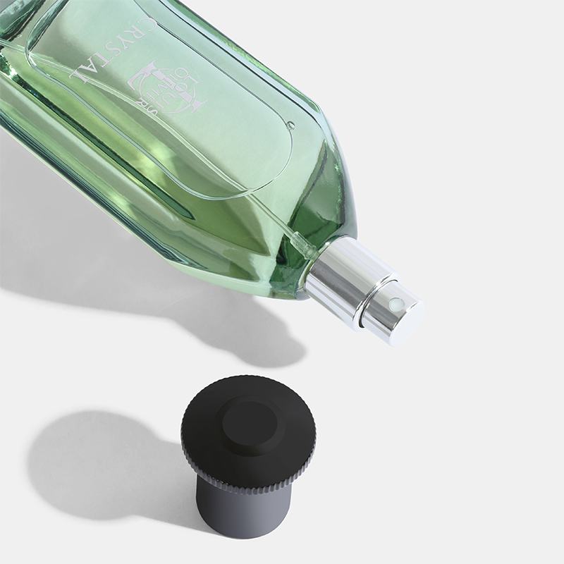 Green perfume bottle with black cap on a light gray background Crystal-Gift-Set House of perfumes India
