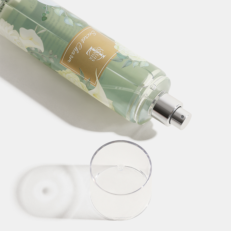 Decorative bottle with floral design and a glass on a light background Crystal-Gift-Set House of perfumes India