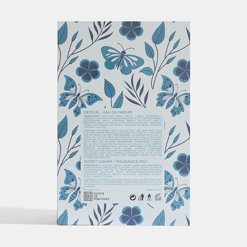 Product packaging with butterfly and floral design on a light blue Crystal-Gift-Set House of perfumes Indiabackground