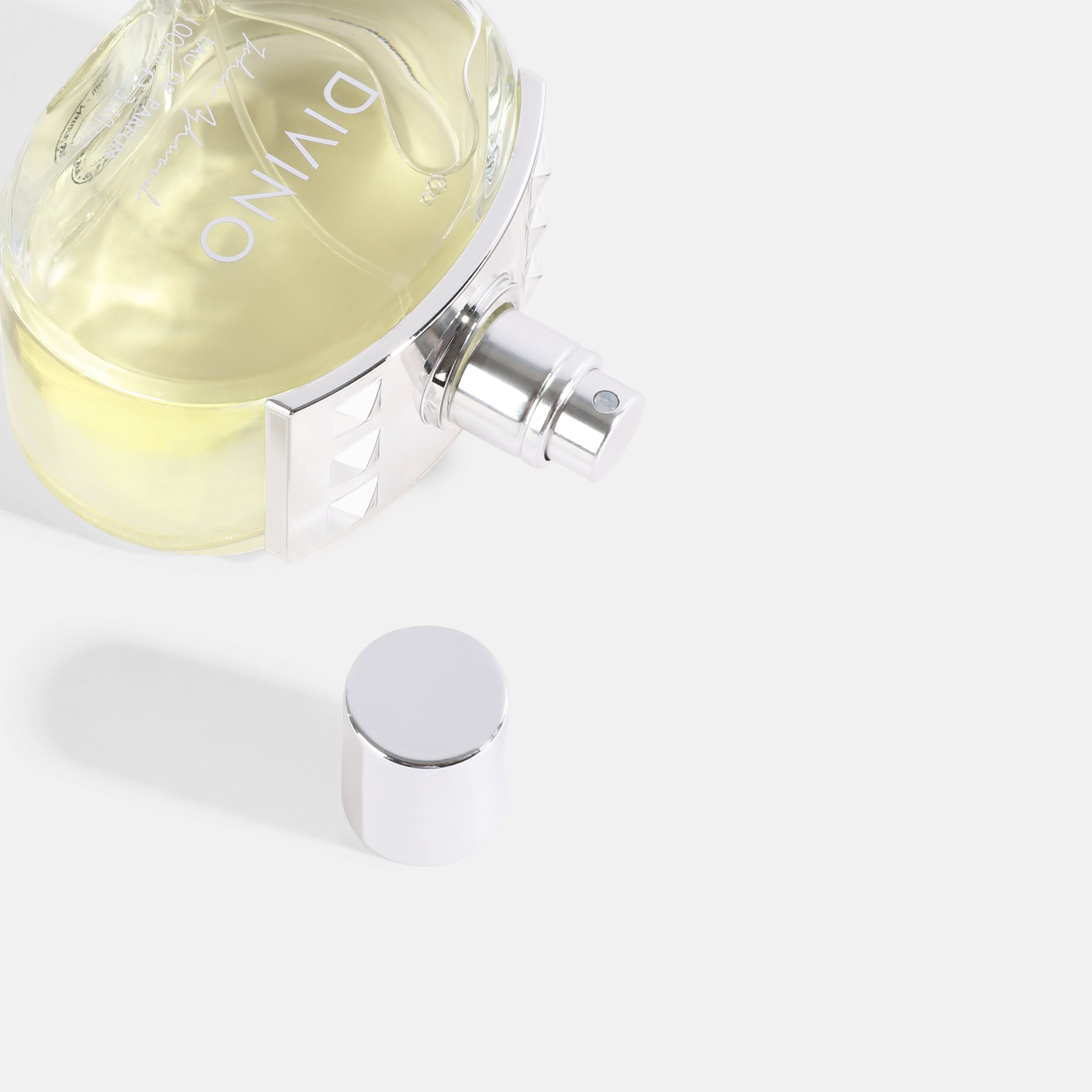 Perfume bottle with 'DIVINO' branding on a white background