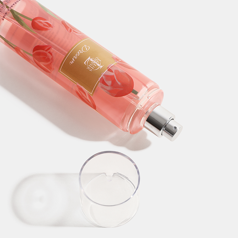 Pink bottle with floral design and a glass on a white background Dream-Gift-Set House of perfumes India