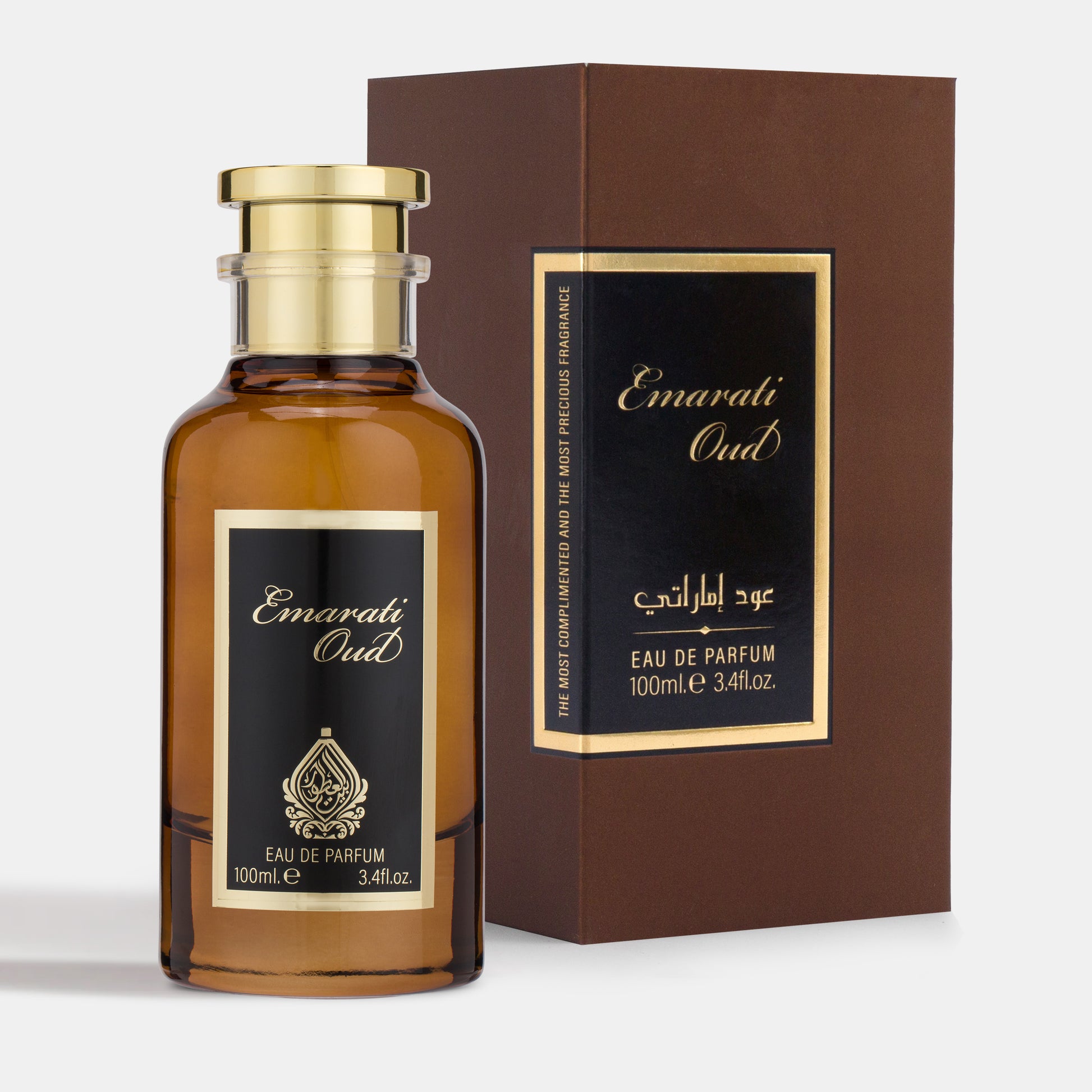 A bottle of Emirati Oud perfume with a brown label and gold cap, next to its packaging box.
