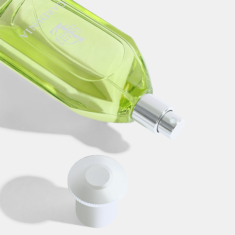 Green perfume bottle with silver cap on a white background Gardenia-Gift-Set House of perfumes India