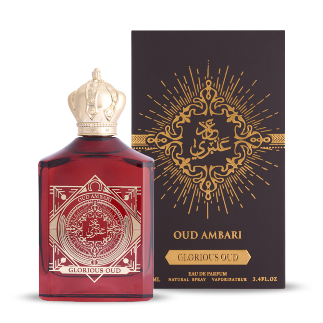 Red perfume bottle with gold detailing and Oud Ambari packaging on a white background