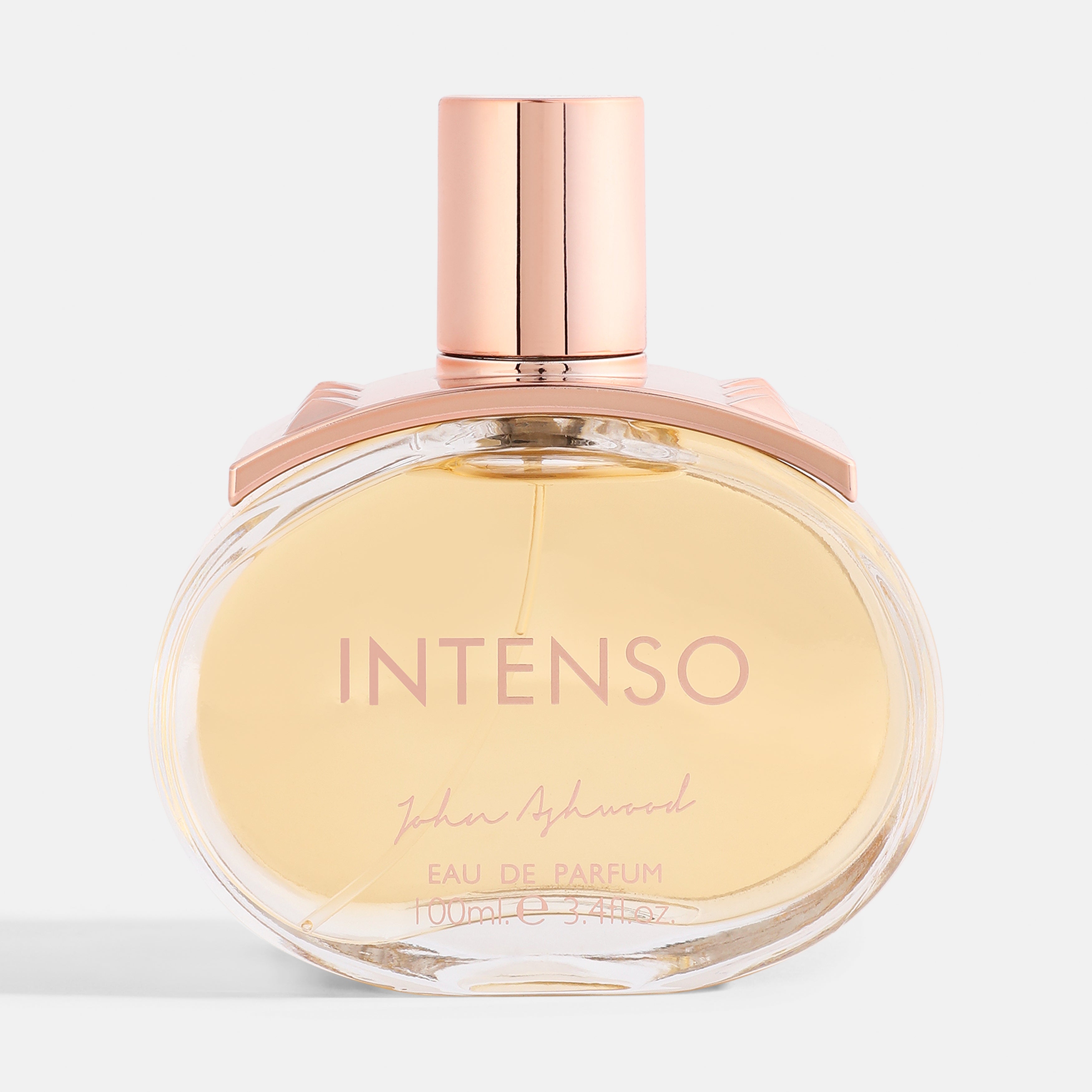 Perfume bottle labeled 'Intenso' with a rose gold cap on a light background