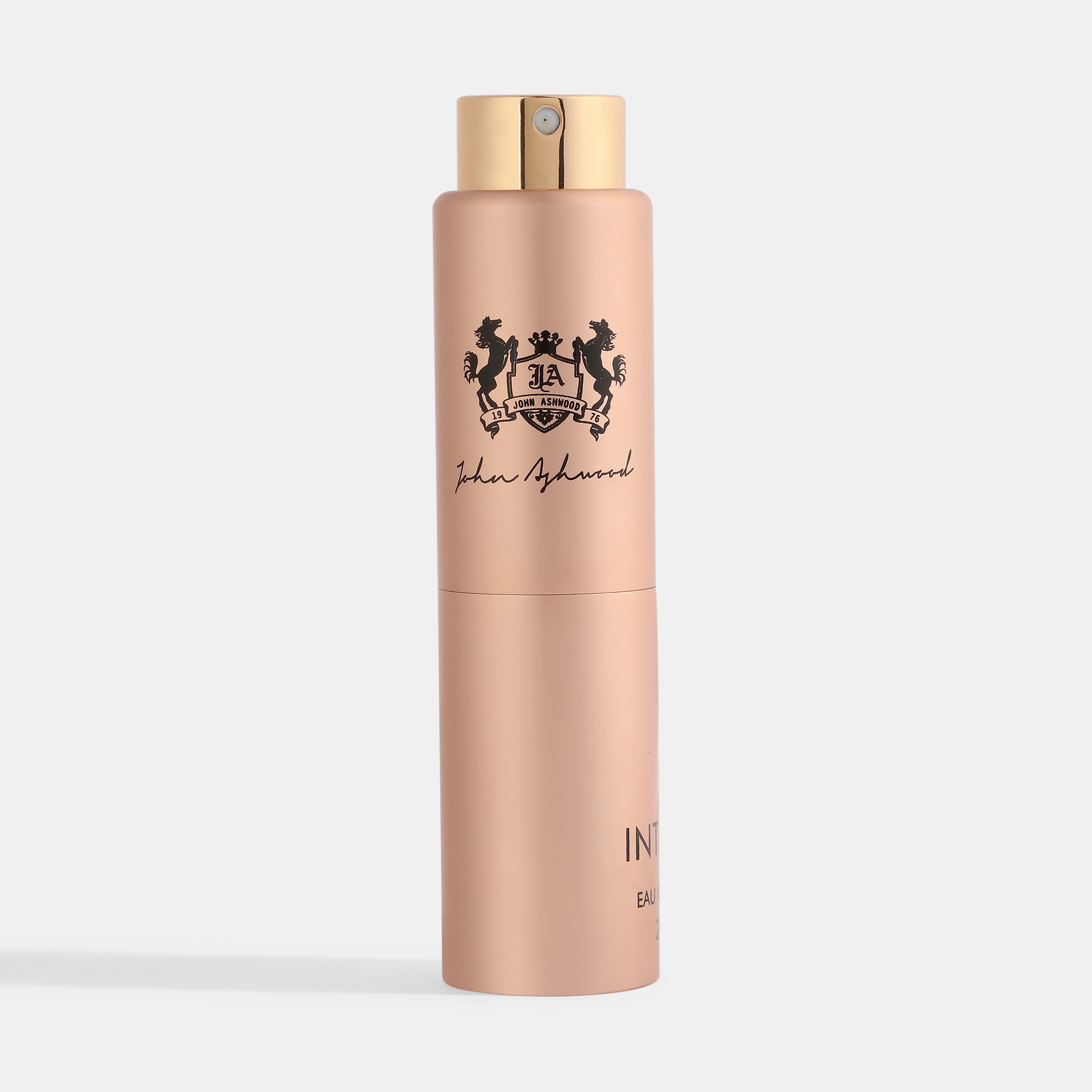 INTENSO perfume bottle with gold cap on a light gray background