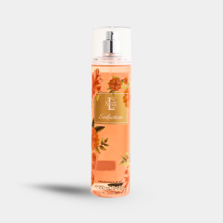A clear plastic bottle of Scented Woodz 'Seduction' body mist with a silver pump, filled with a peach-colored liquid and decorated with orange floral illustrations, set against a light gray background.