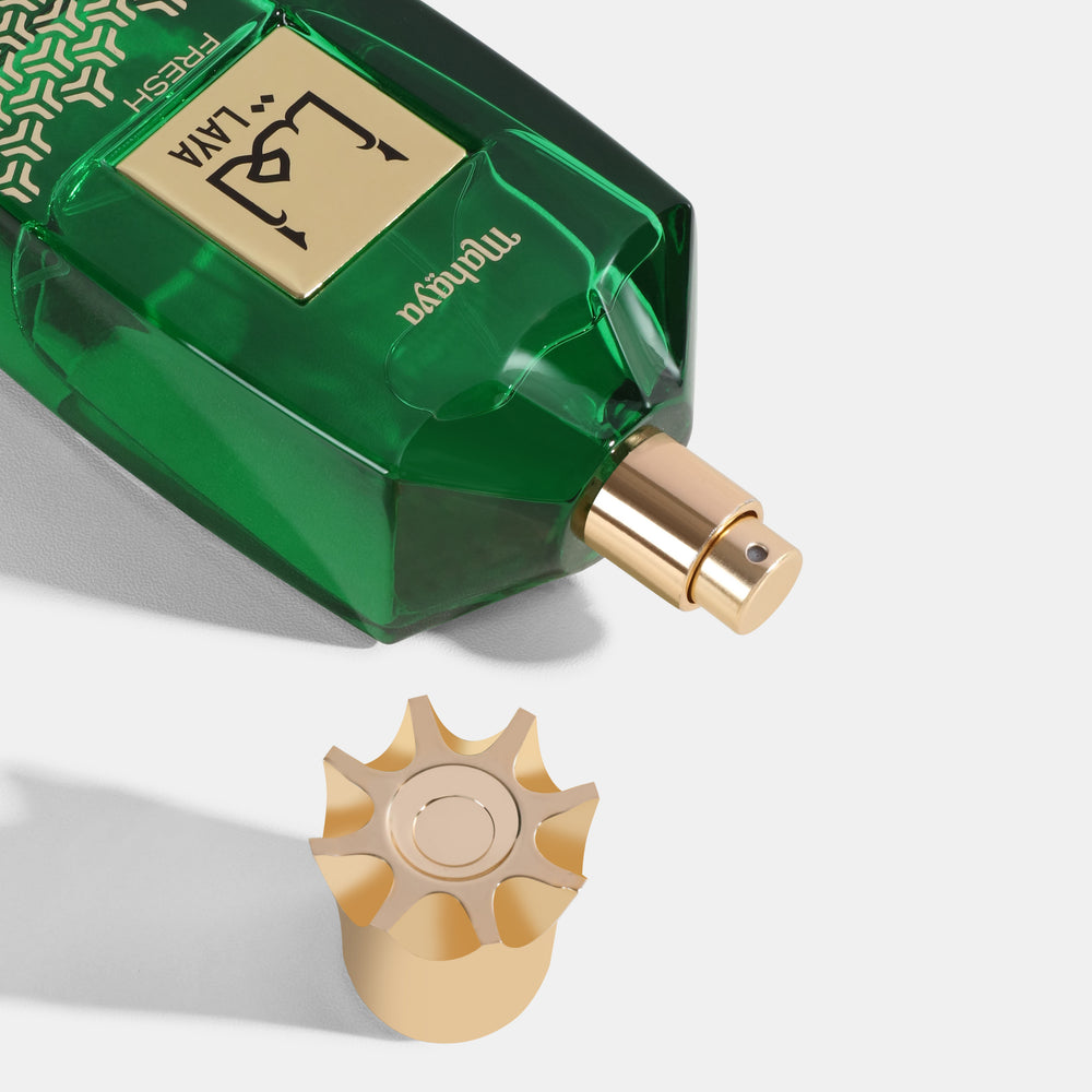 Laya Fresh Green perfume bottle with gold cap on a white background. House Of Perfumes India