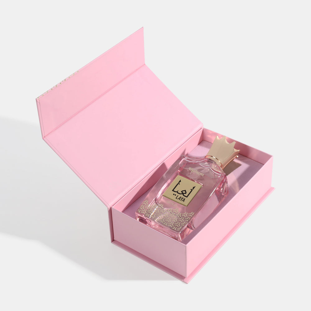 Laya Gold Perfume bottle in a pink box on a light gray background. House Of Perfumes India