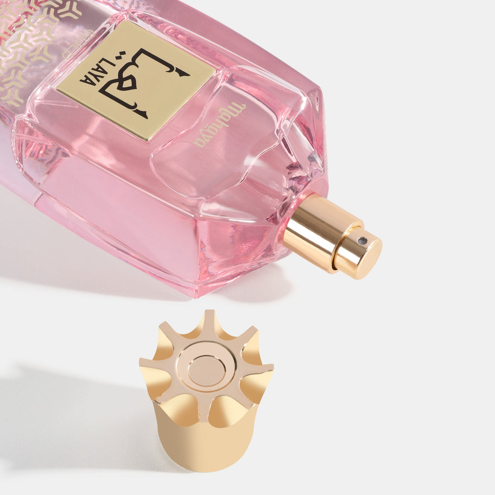 Laya Gold Perfume bottle with gold cap and pink label on a white background. House Of Perfumes India