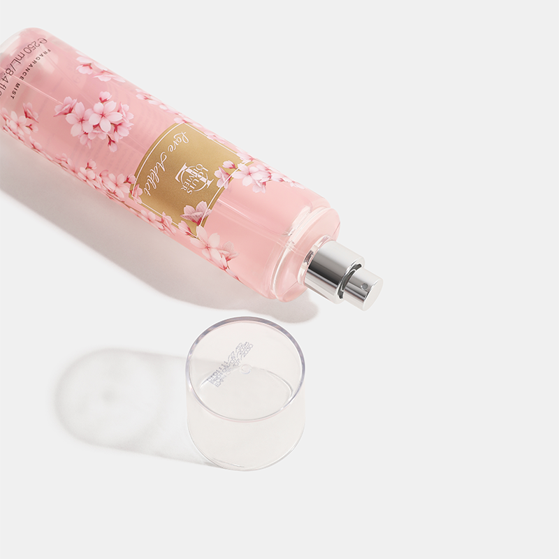 Love-Addict Pink floral perfume bottle with a clear cap on a light background. House of Perfumes India