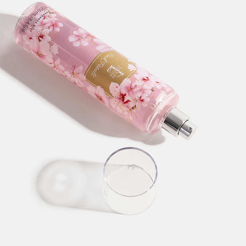 Pink petals floral bottle with a clear glass on a white background. House   Of Perfumes India