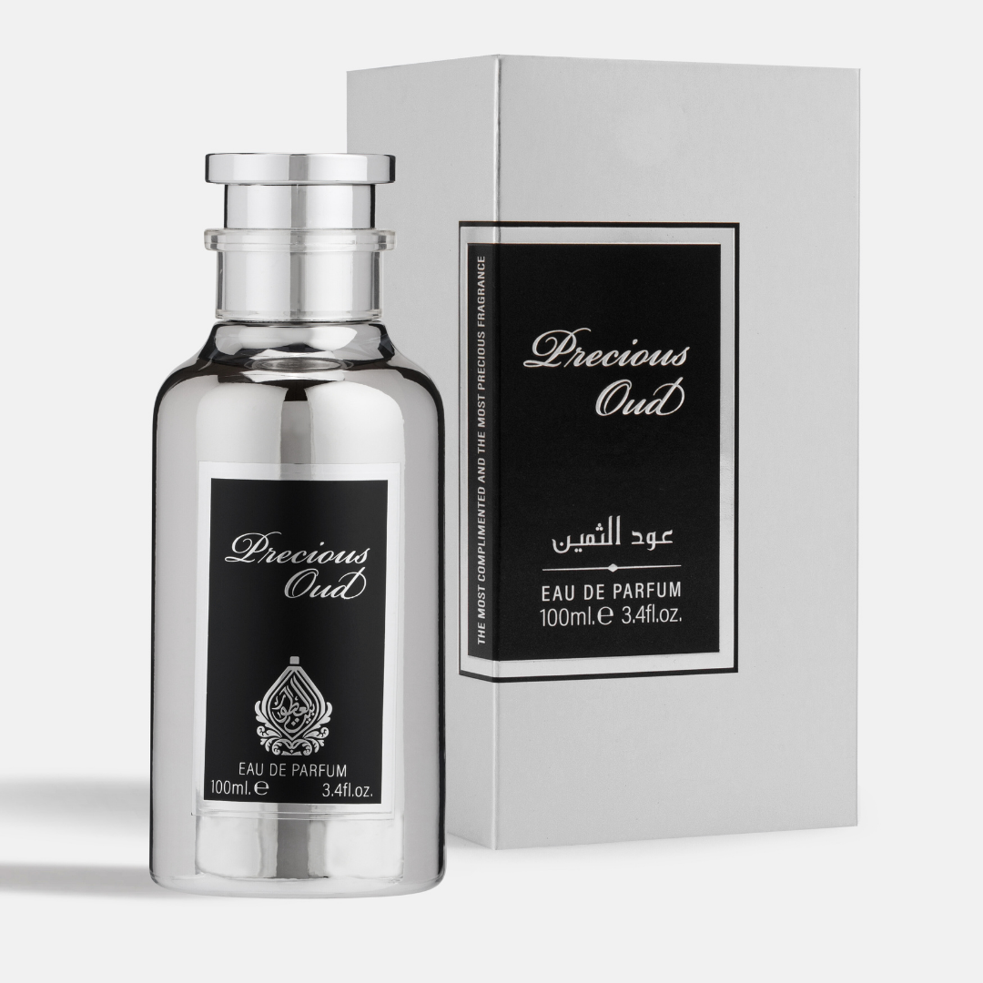 Silver perfume bottle and packaging with 'Precious Oud' branding on a white background