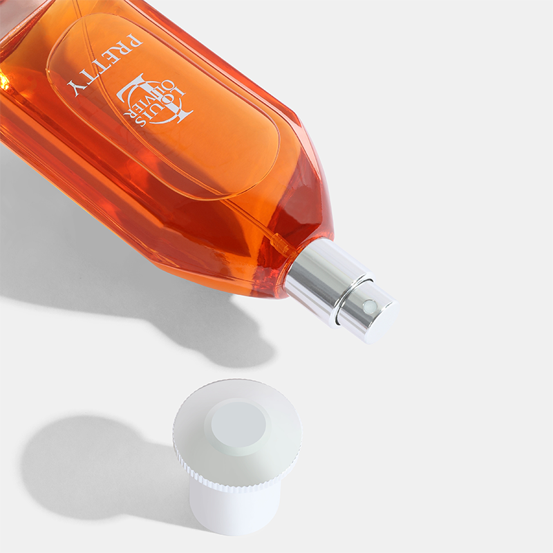 Orange perfume bottle with a silver cap on a white background. Pretty-Gift-Set House of perfumes India