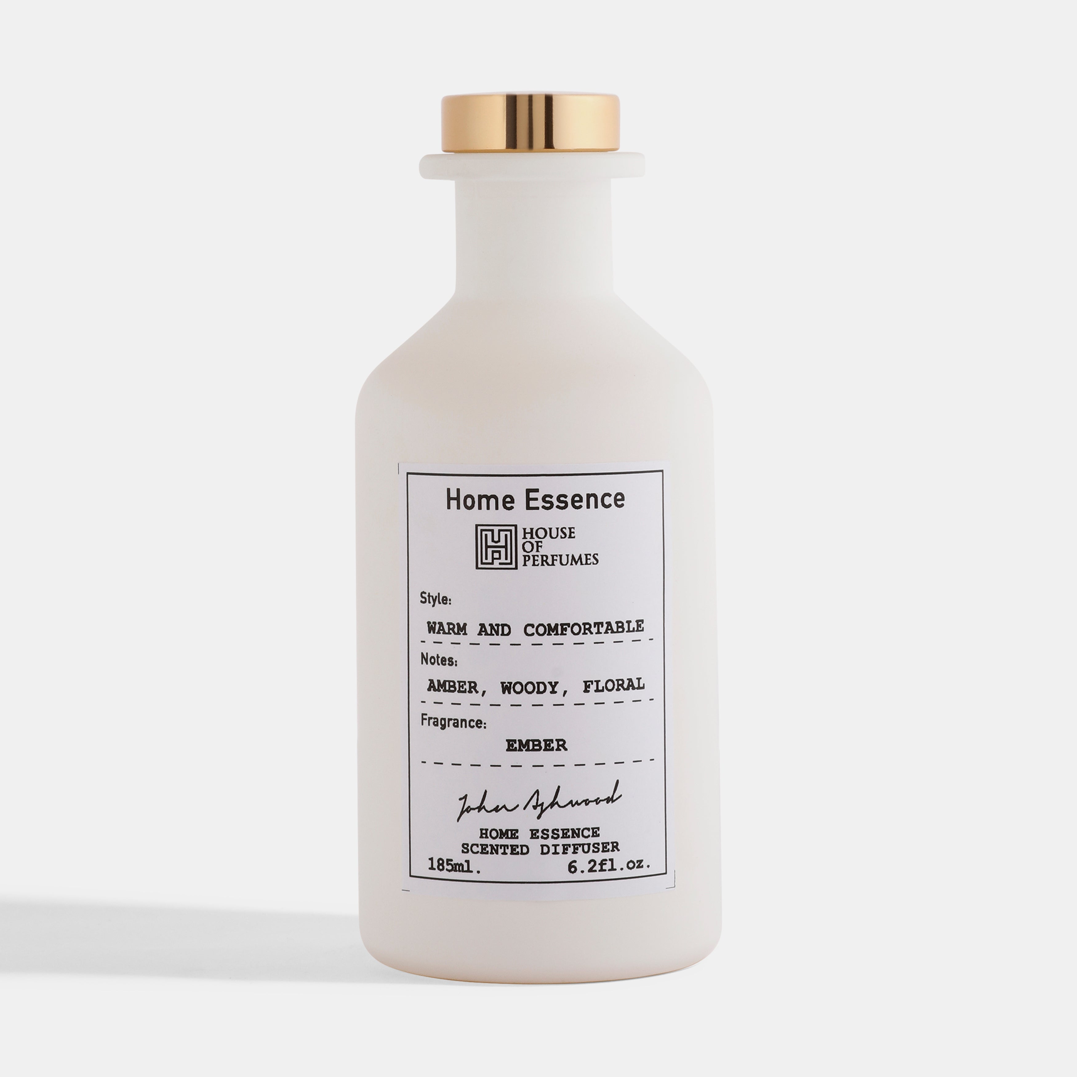 White diffuser bottle with gold cap on a white background