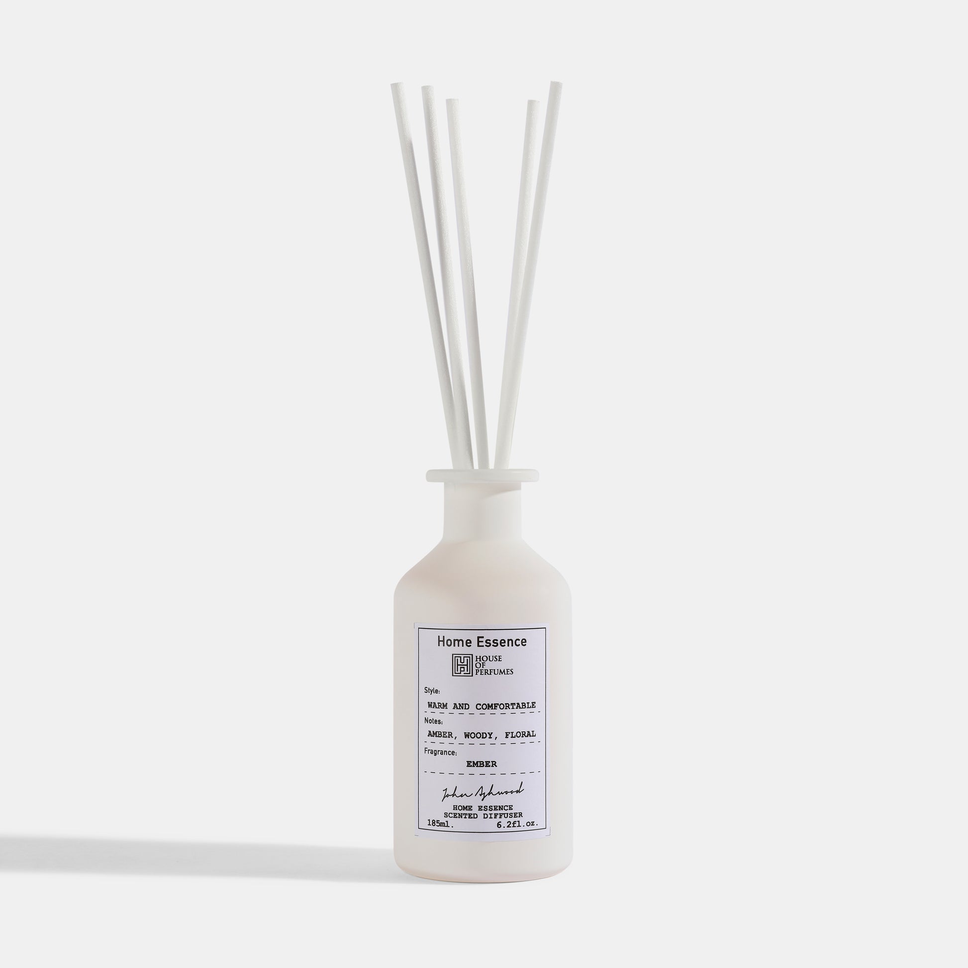 White diffuser bottle with reeds on a white background