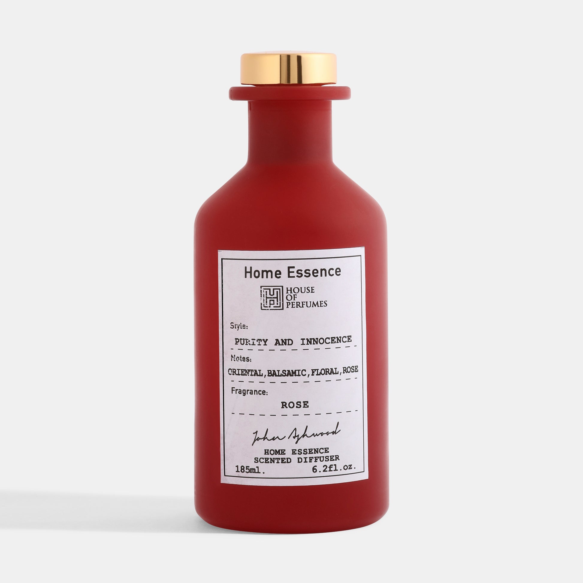 Red Home Essence scented diffuser bottle with gold cap on a white background