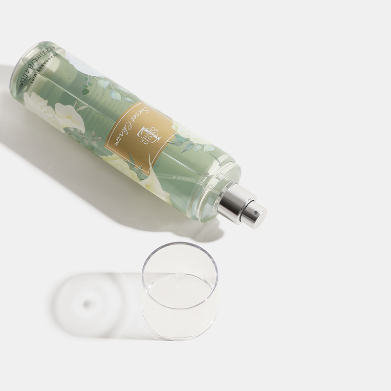 Secret Charm Green bottle with floral design and a gold label on a white background. House Of Perfumes India