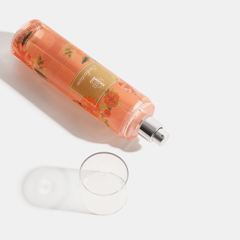 Seduction Pink bottle with floral design and a glass on a white background. House Of Perfumes India