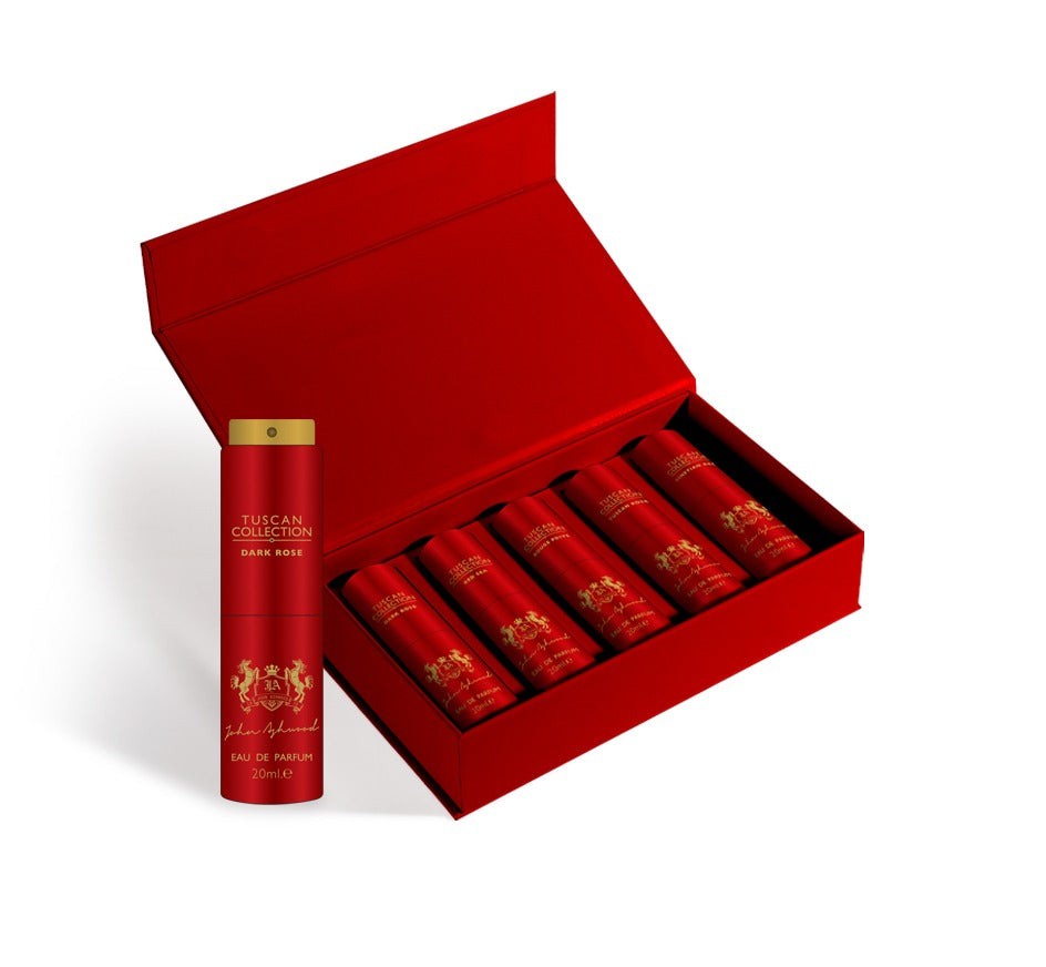 Red perfume set with a bottle and 5 smaller bottles in an open box on a white background. House Of Perfumes India